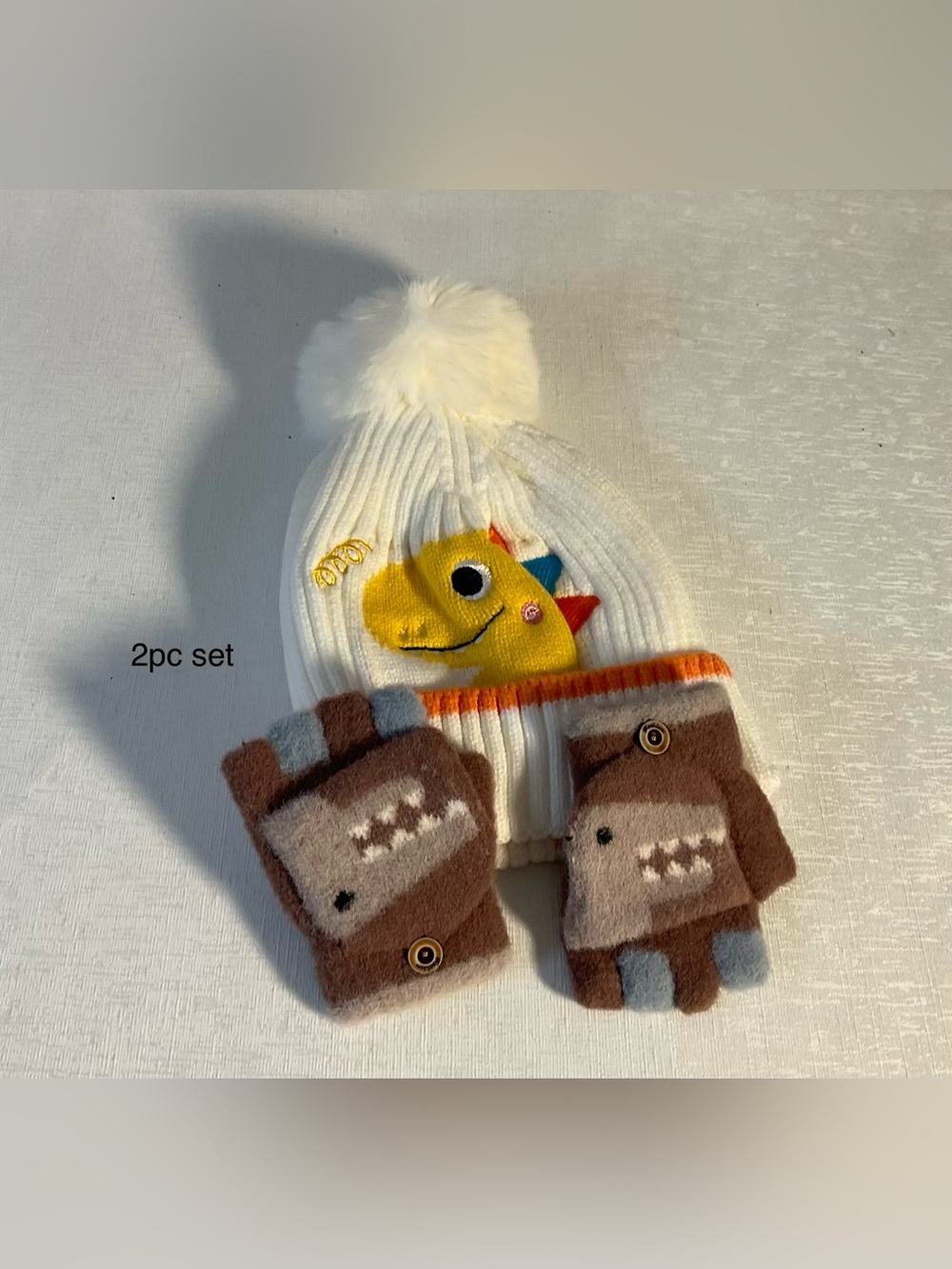 Kids White Pom-Pom Beanie and Brown Dino Mittens Set